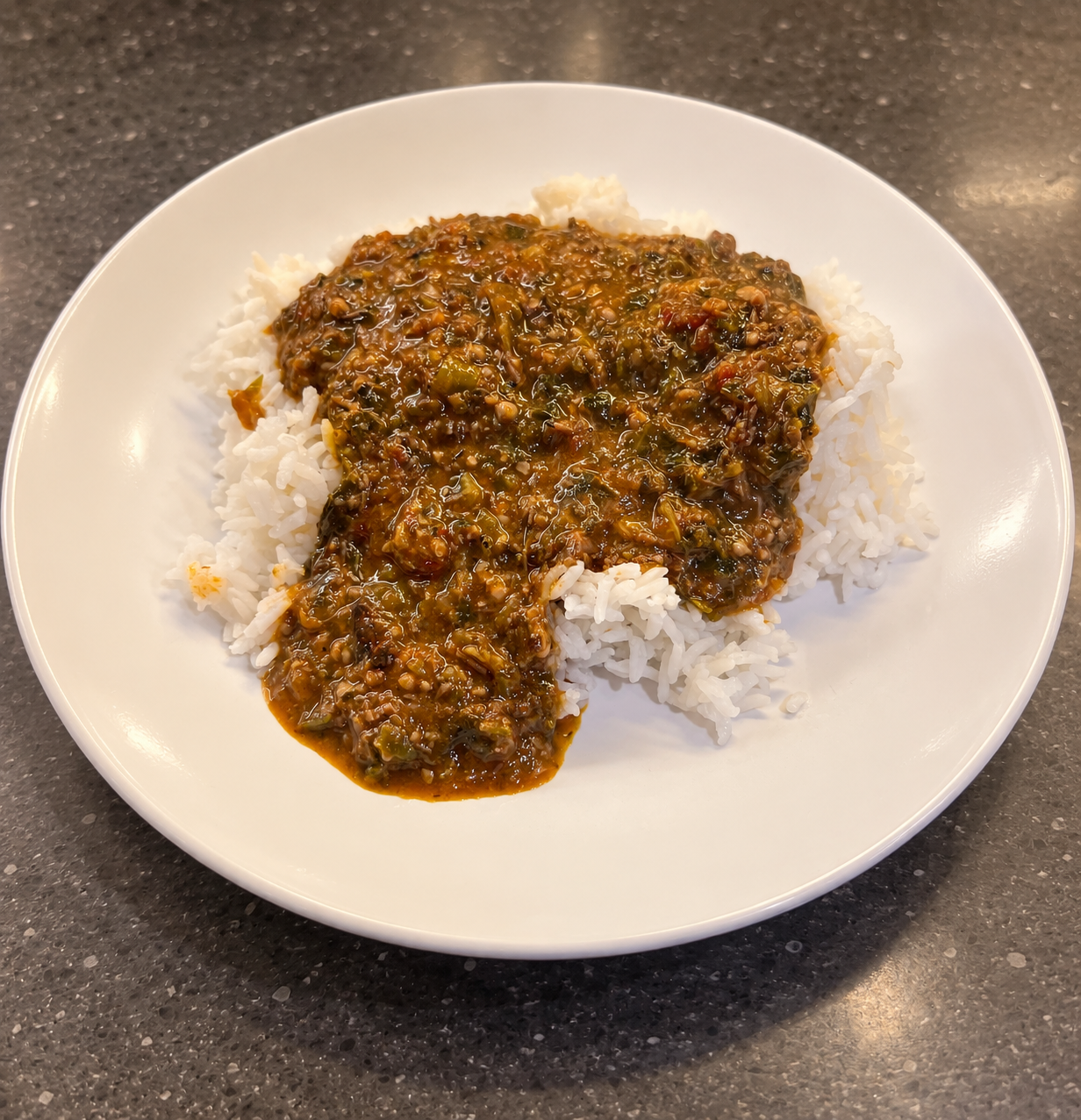 SuperKanja/African Gumbo served over white rice on a plate